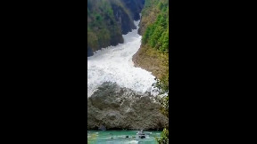 Massive avalanche rolling down a valley