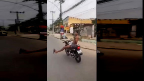 Biker swerves through traffic