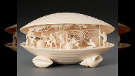 Ivory carving of a shell with fishermen inside. Japan, around 1900
