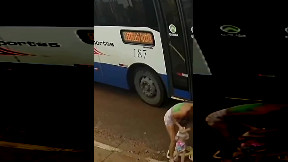 Mother walking her pram is almost run over by bus