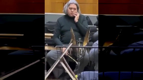 Orchestra musician takes phone call during performance