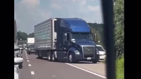 Driver Uses Shoulder to Pass Truck