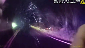 Marin County sheriff breaks car window to rescue woman in flooding creek