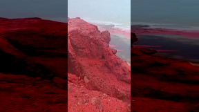 Heavy rain at the Red Beach in Hormoz island, Iran