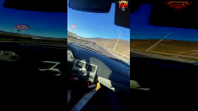 Guy tries to squeeze between two trucks