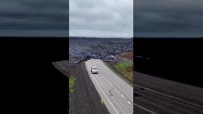Iceland lava flow engulfs road