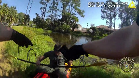 Flagler County Sheriff's deputy plunges into pond to rescue dog named Elroy