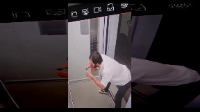 Man tripping in an elevator