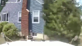 Dump truck crashes into house in New Jersey
