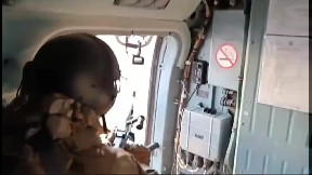 Shooting down the kamikaze drone from a machine gun on board the Mi-8