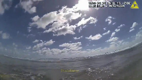 Bodycam video shows deputies help rescue woman who was floating face-down in the ocean