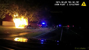 Body cam video shows heroic officers, witness rescuing driver after fiery crash