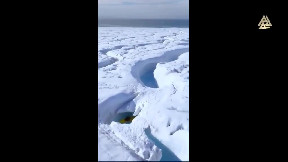An Ice Waterfall In Svalbard, Norway