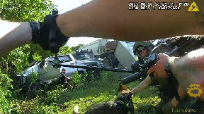 Body cam shows stolen truck suspect slam into train during chase, SWAT standoff
