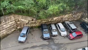 Wall collapses on cars due to rain