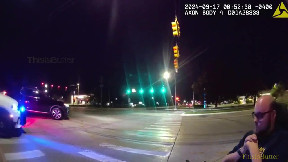 Kentwood Police Officers push man home after power chair dies on the street