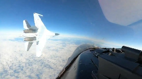 Russian Su-35 fighter jet's near miss with U.S. F-16