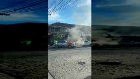 Man ignores the fact his car is on fire and loads it up with beer