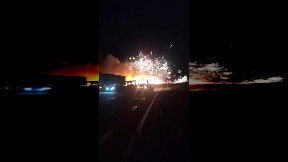 Fireworks explode on road after crash