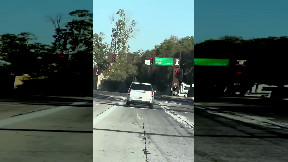 Fleeing hit and run driver runs red light and gets T-boned